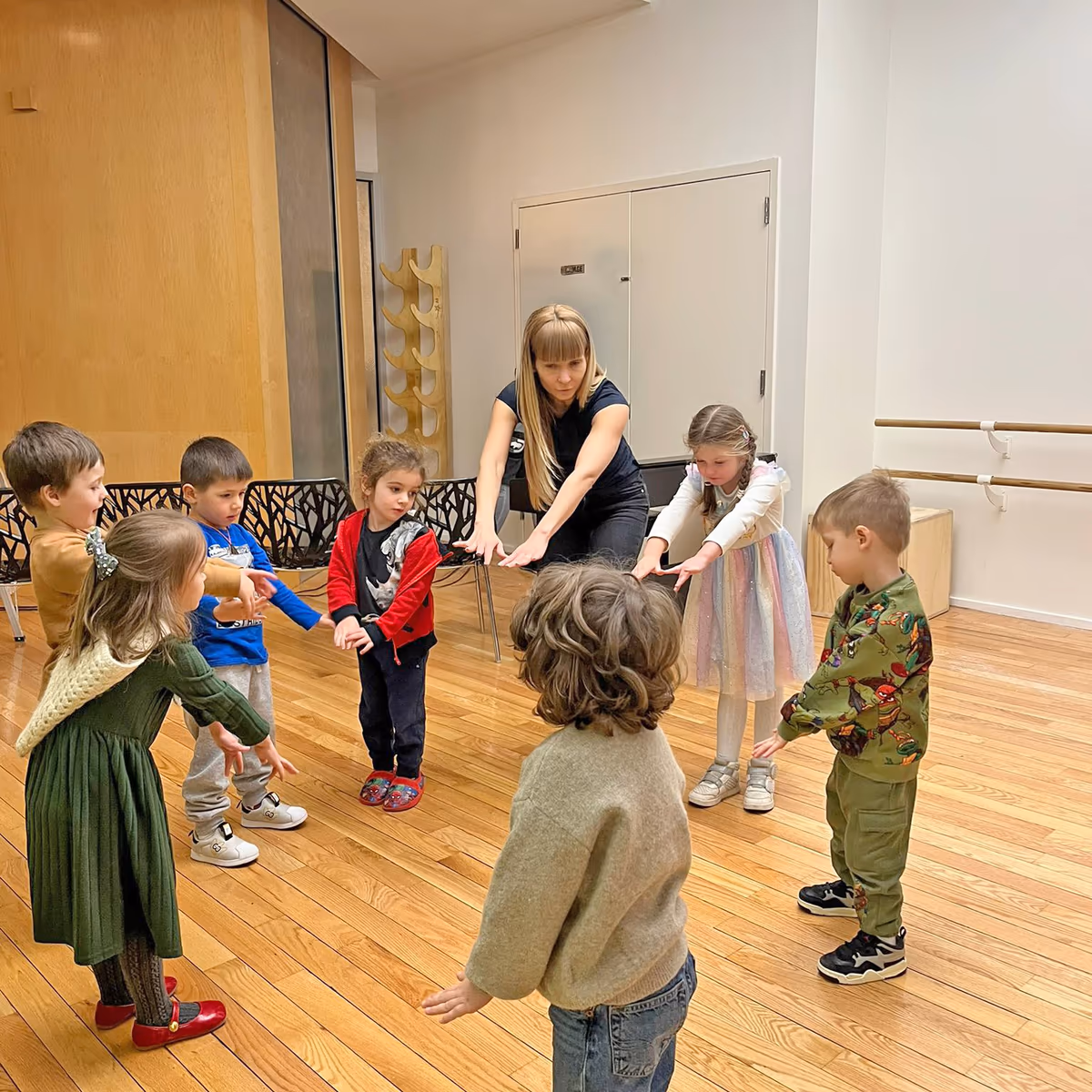 Children playing instruments in a music class at a Financial District preschool.