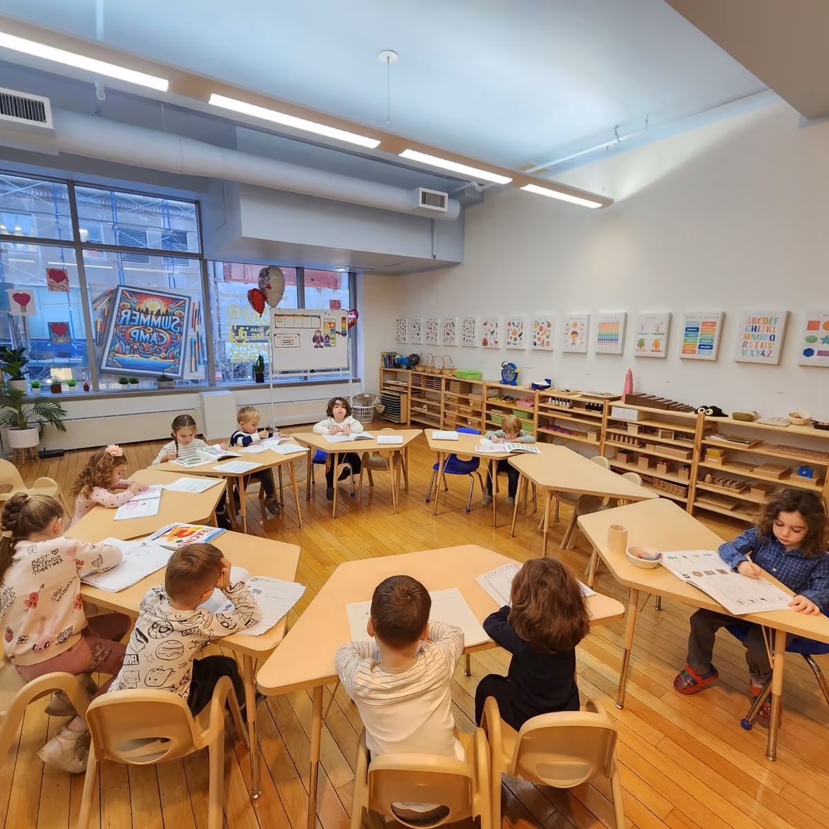 Montessori classroom at a FiDi preschool with child-sized furniture and materials.
