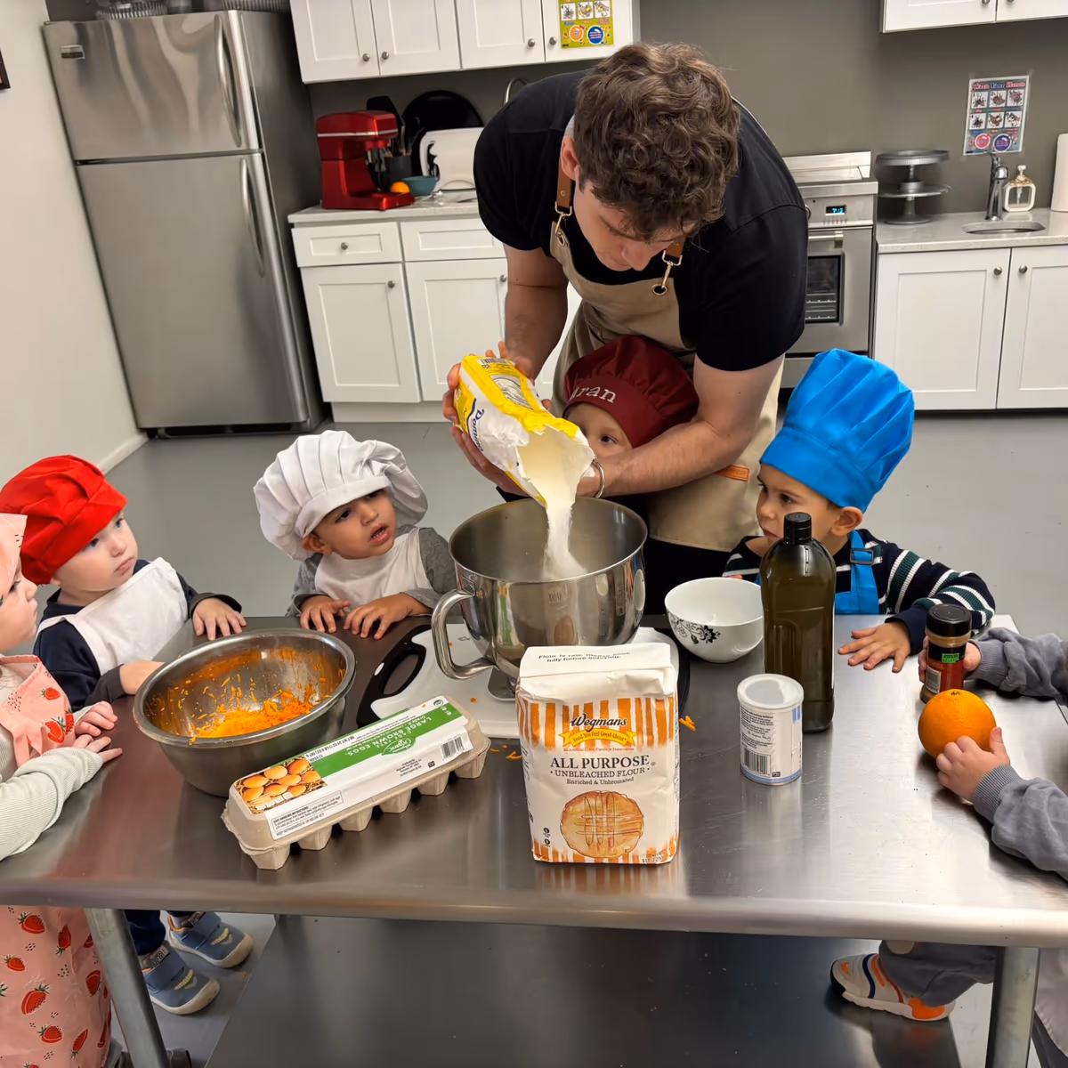 Children eating lunch at a daycare in FiDi with healthy food options.