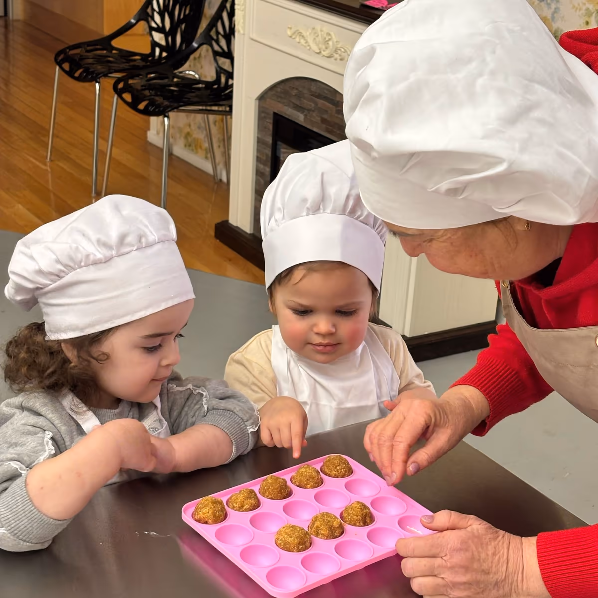 Chef preparing food in the kitchen at a daycare in FiDi.