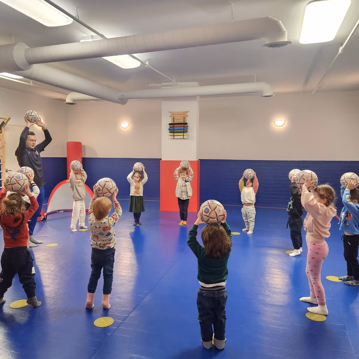 Children doing soccer drills at downtown Manhattan daycare
