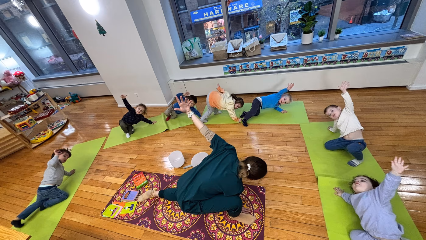 Children practicing yoga at Golden Minds Prep toddler program