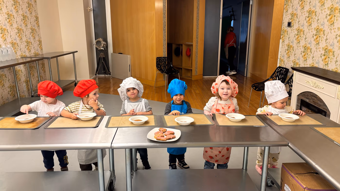 Children mixing ingredients in cooking class at Golden Minds Prep